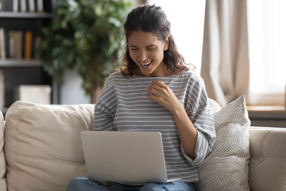 Person comfortably using simple lottery tracking software